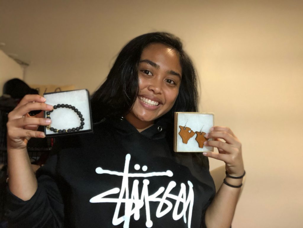 A JAHI Company Program student showing the products she made